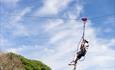 man on zip wire at Skern Lodge