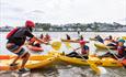 children in kayaks at skern lodge