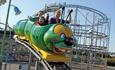 three people riding the caterpillar ride @ The Milky Way Adventure Park