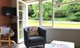 Spreacombe Gardens lounge area with table self catering cottages