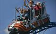 family of 4 riding the cosmic typhoon ride @ The Milky Way Adventure Park